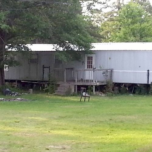 Front view of tin roof on mobile home, Adds years 