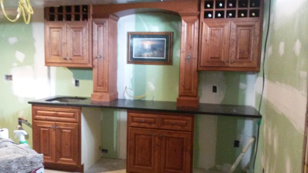 Basement back bar with granite countertops.