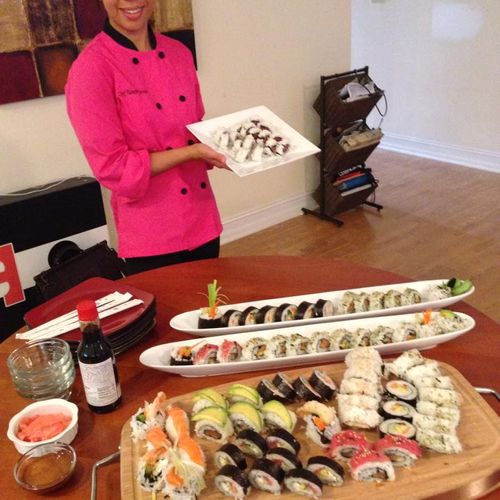 Chef Monette with a sushi feast prepared for a cli