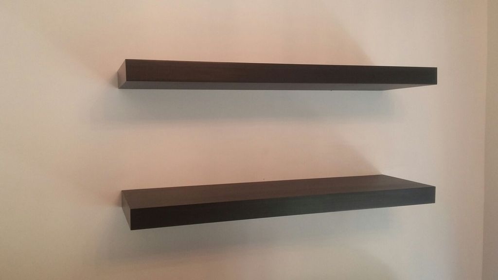 wooden shelves installed concrete wall