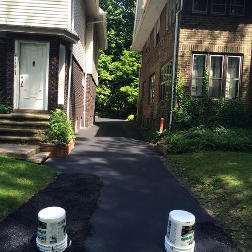 Driveway seal coated and asphalt