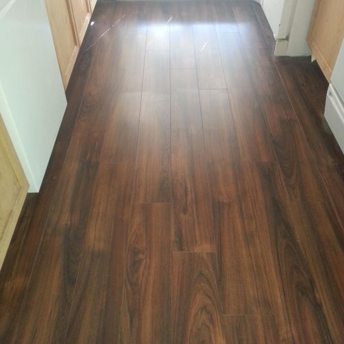 Laid new laminate wood flooring in kitchen
