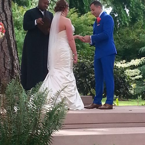 going over the vows that at an outdoor wedding. It