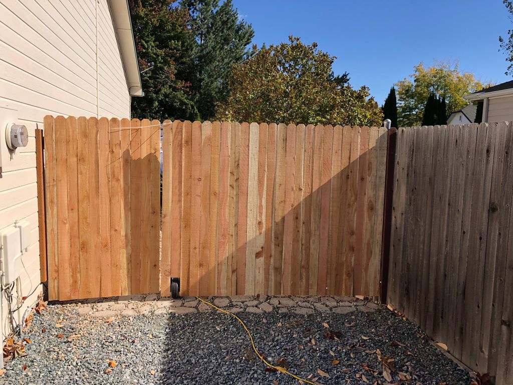 Custom double gate that covers boat parking area