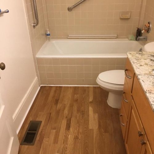 New hardwood floor installation in bathroom locate