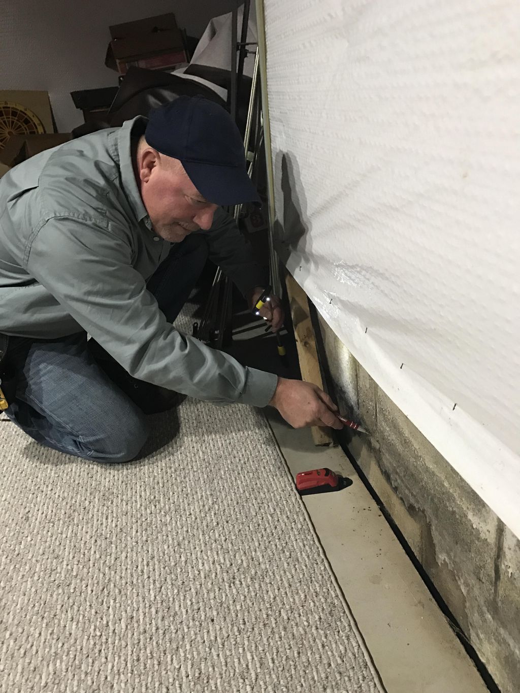 Checking foundation for moisture.