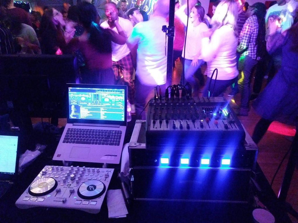 Rockin' the house as a DJ for a group of entrepren