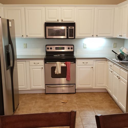 Kitchen After: Painted cabinets, added back splash