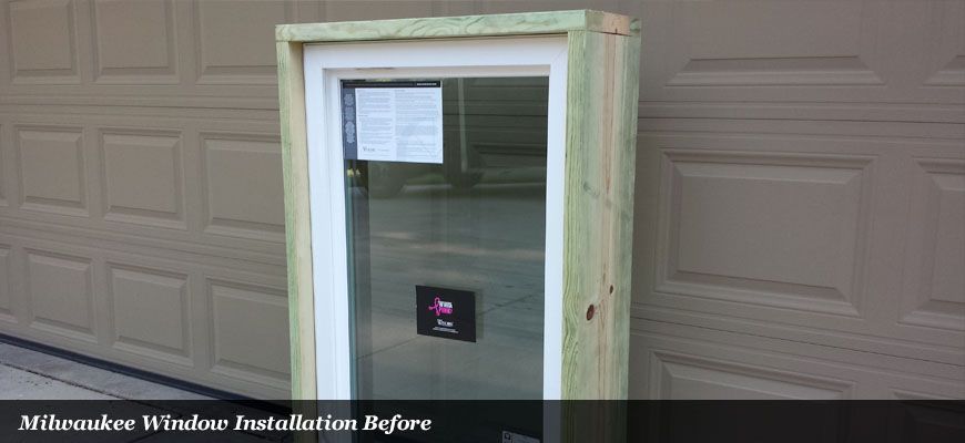 Vinyl window mounted in treated buck frame
