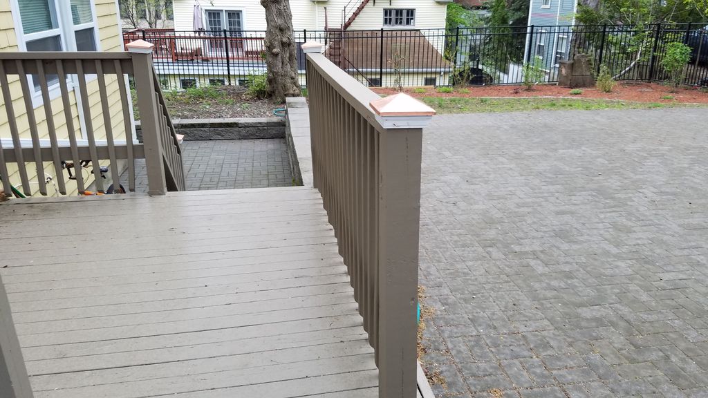 Composite deck and staircase with paver landing.