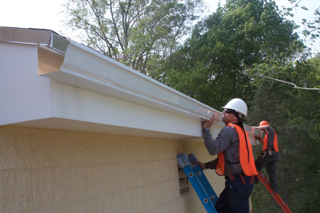 Installing gutters on commercial buildings