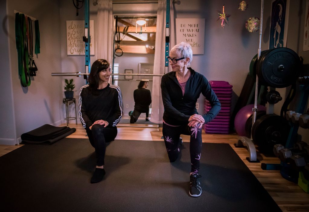 Personal trainer Taija Ventrella stretching with a