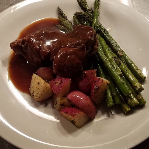Braised short Ribs with red wine demi, grilled pes