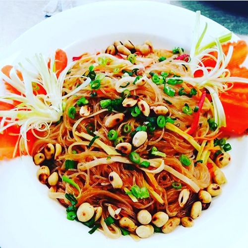 Asian Noodle Salad garnished with roasted peanuts