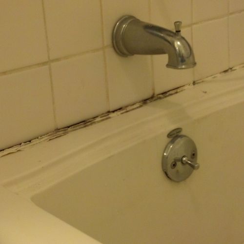 Tub & shower caulking (BEFORE)