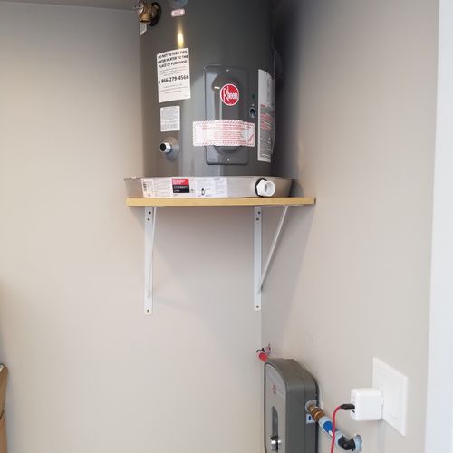 Tankless and 10-gallon water heater tanks installe