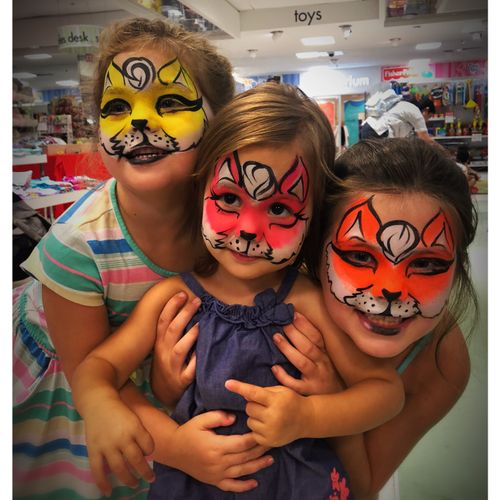 3 little fox sisters face painting at a grand open