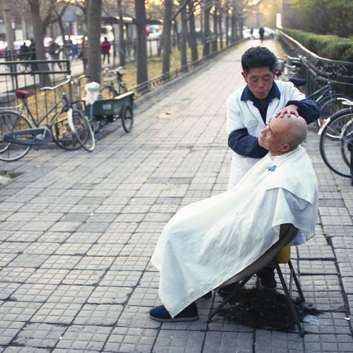 A close shave on the street, Beijing, China