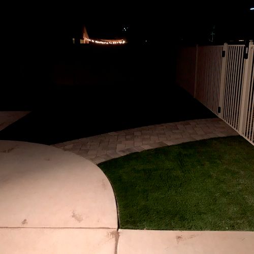Small area of artificial turf installed by walkway