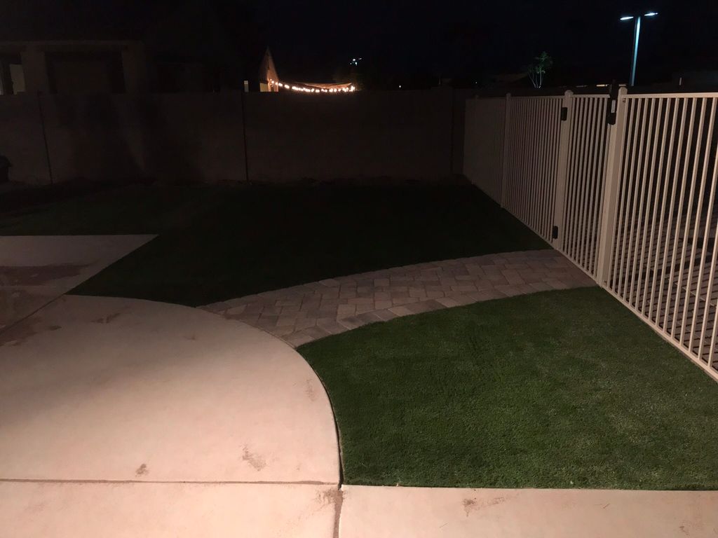 Small area of artificial turf installed by walkway