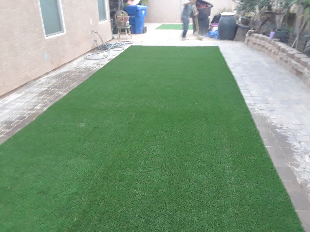 After picture artificial turf and pavers installat