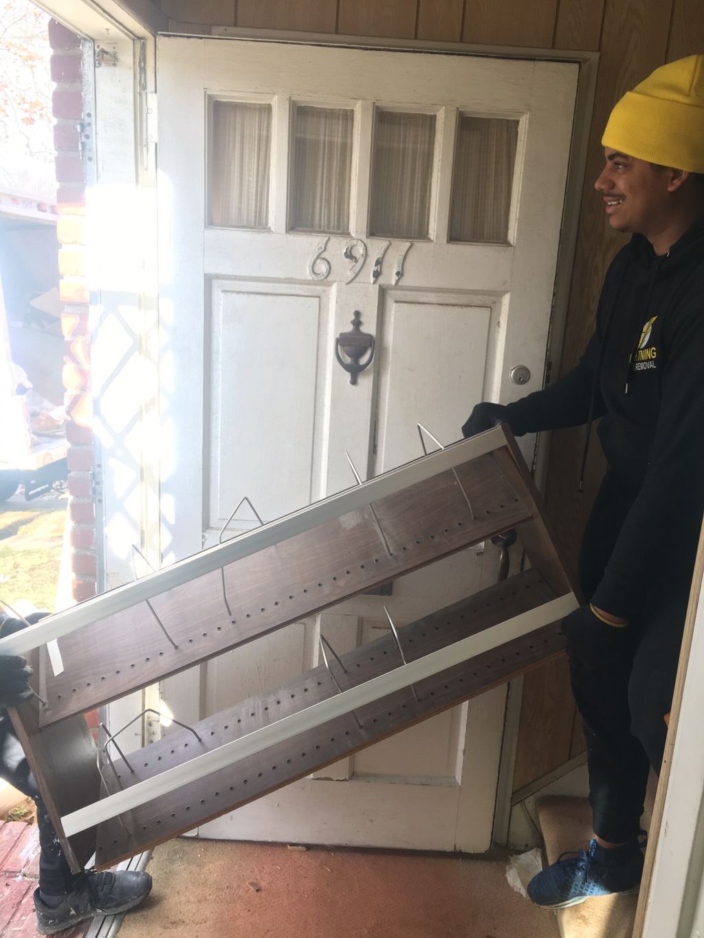Team in action, taking out some items from a house