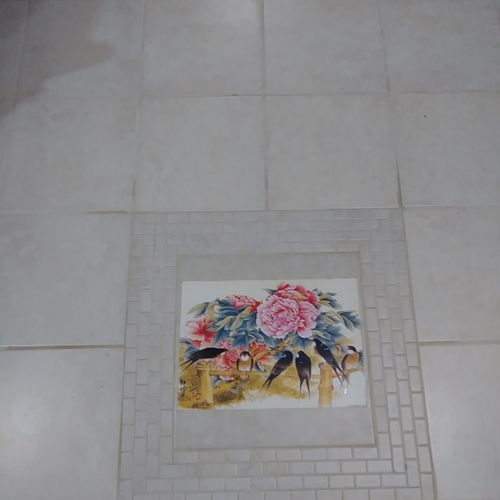 detail of 700 sf tile flooring install in basement
