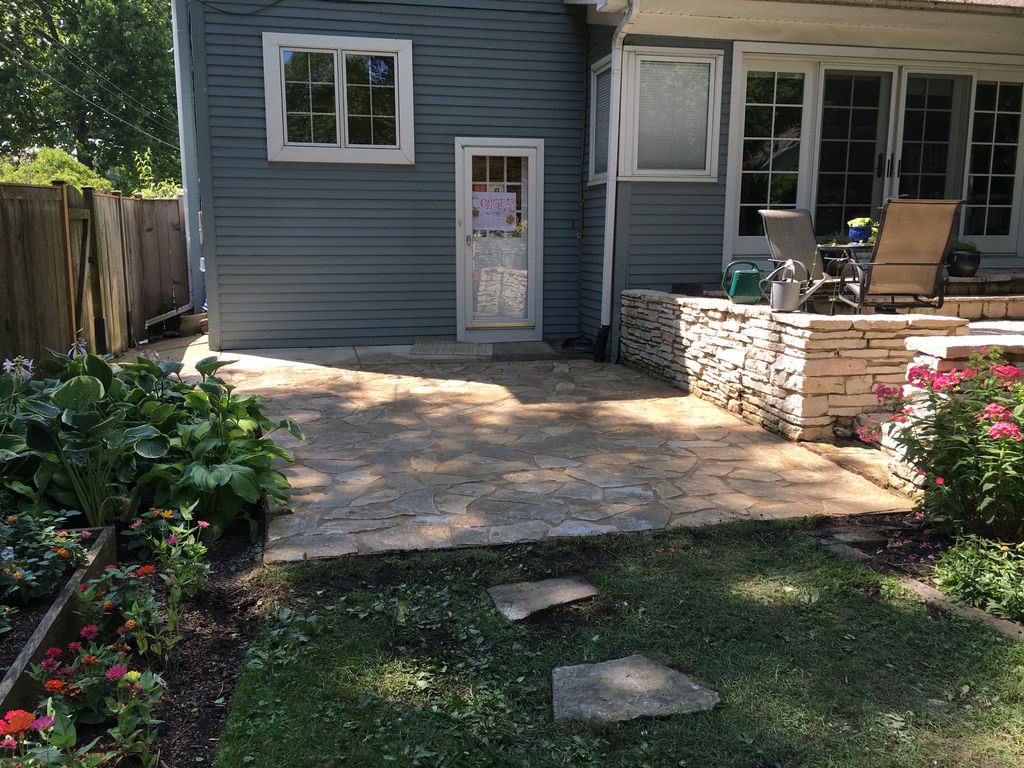 Backyard stone patio and planting