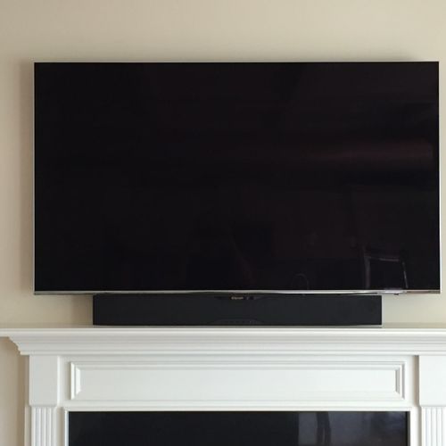 John did a very nice job mounting a 65" TV above t