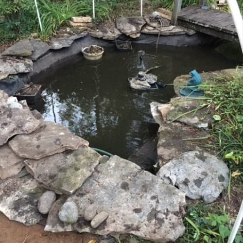 They repaired our fish pond by taking up the rocks