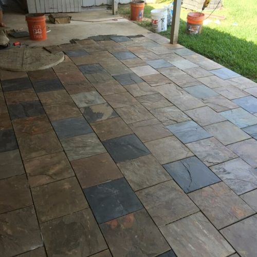 Over laid slate tile over concrete patio .very pro