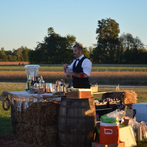 Todd tended bar at our outdoor barn wedding at a b