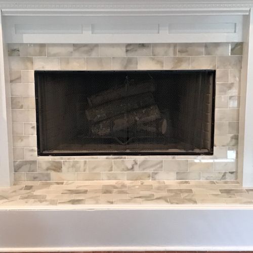 I hired Andrew to install marble tile on my firepl