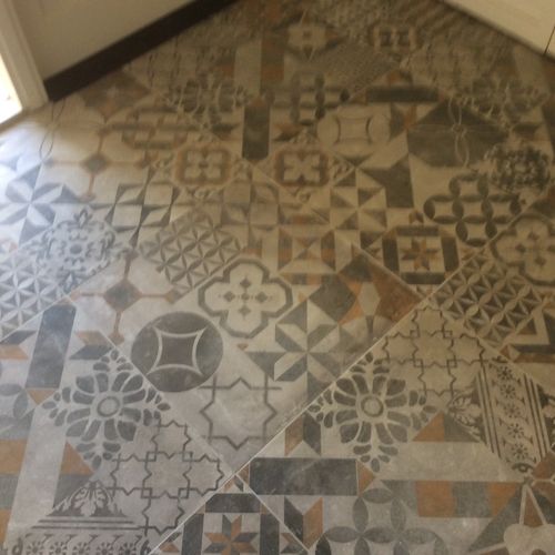 Mark did a beautiful job on our foyer tile. He fin