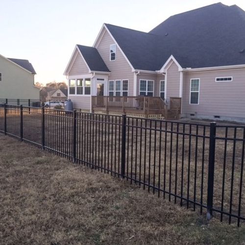 Ryan installed a black aluminum fence and custom l