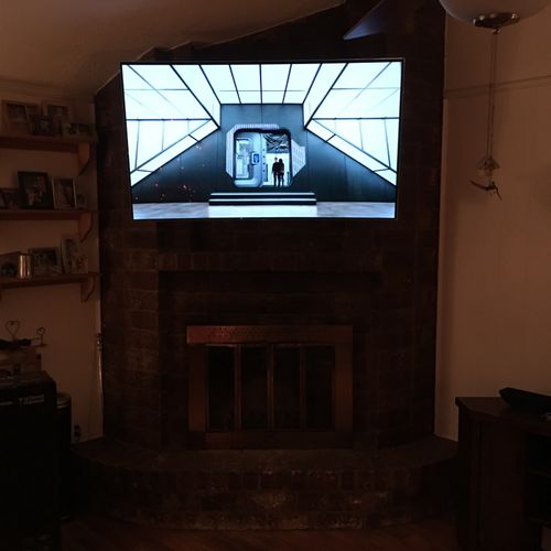 QMS mounted my new TV on my fireplace mantel.  Exc