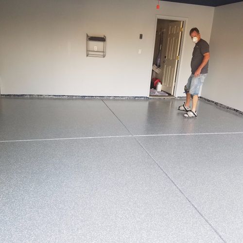 I had my garage floor done with epoxy and chips an