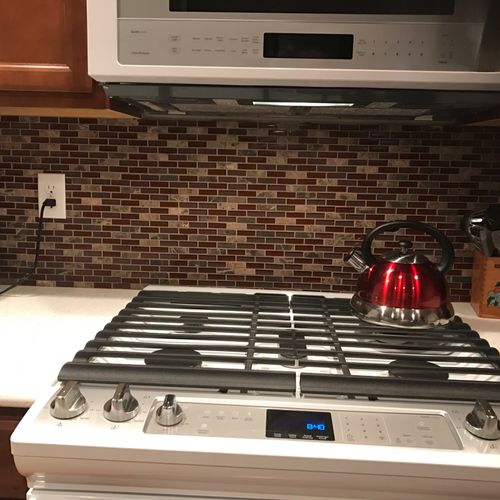 Andrew tiled backsplash in three bathrooms and our