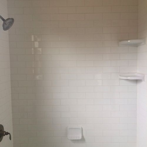 Shane replaced white subway tile to around bathtub