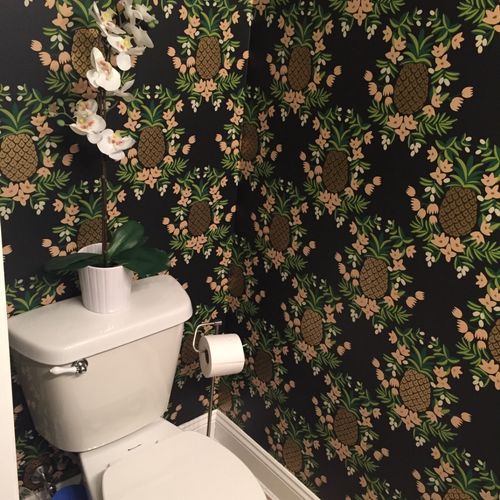 Great job wallpapering small powder room with very