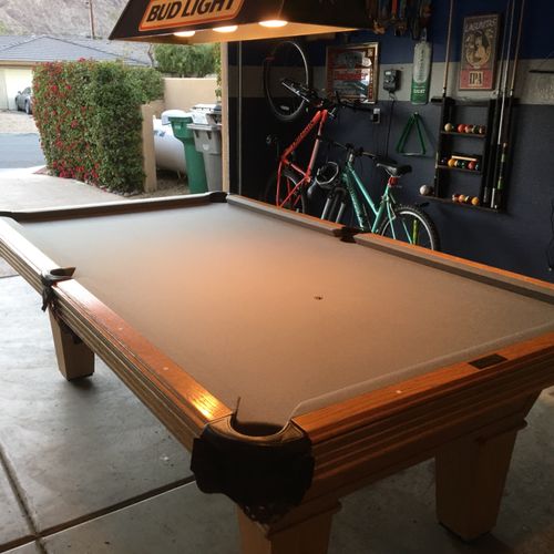 Ozzie replaced the felt on our pool table from gre