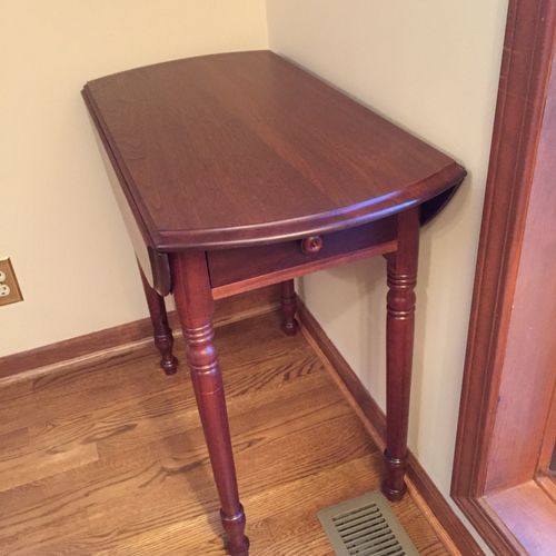Chase refinished an antique walnut drop leaf table