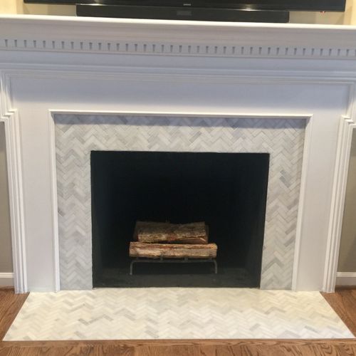 Henry did a fabulous job tiling our fireplace with