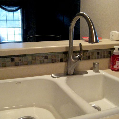 Corey installed a new kitchen faucet and air gap. 