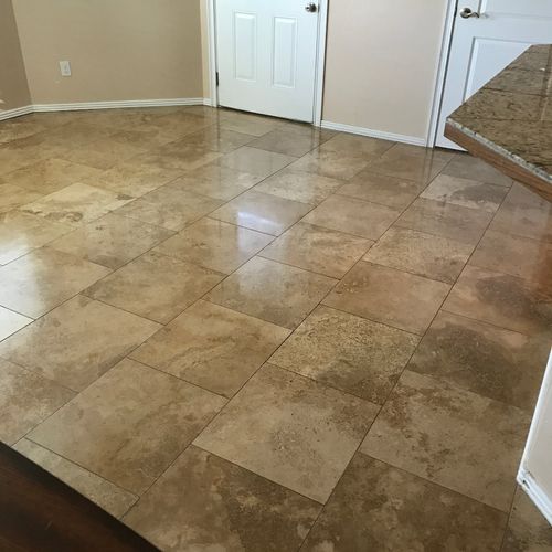 They made a tired travertine tile floor look new a