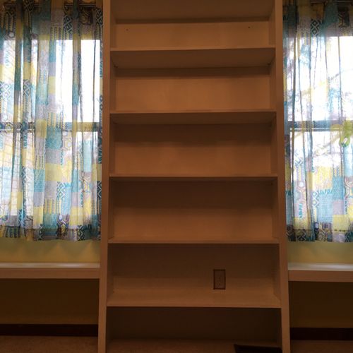 Built a large bookcase with adjoining window seats