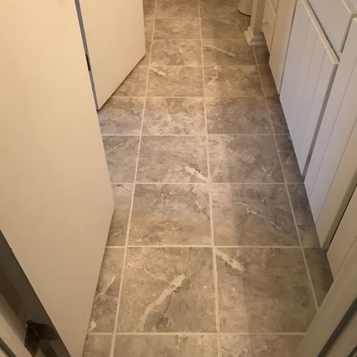 Bob installed new tile and a toilet in our bathroo