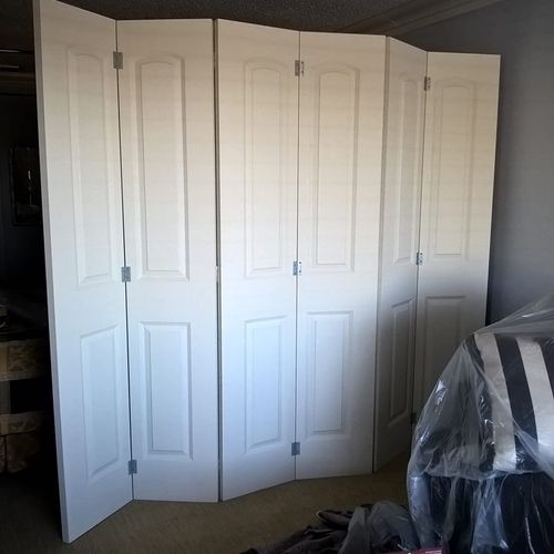 Jim built a room divider and hung two new bedroom 