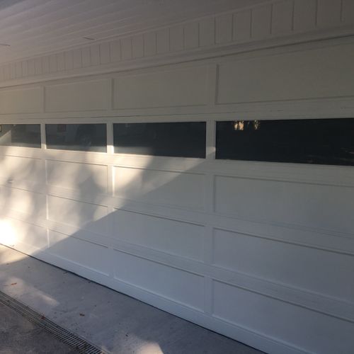 Jesse from Crowe Painting sanded our garage door a