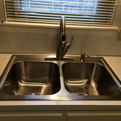 Lyle installed our new sink, faucet and garbage di